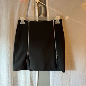Bebe black mini skirt with zipper accents